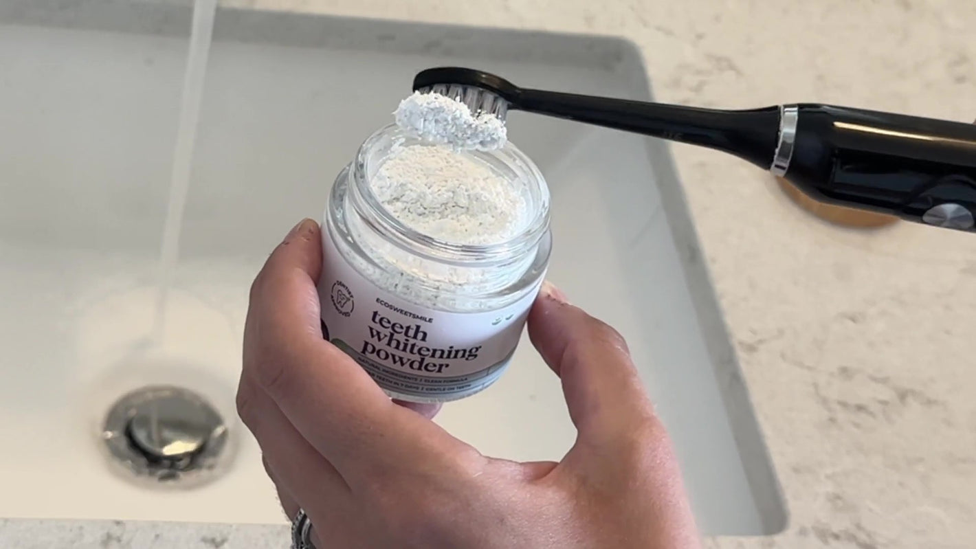 Step 1: Toothbrush dipped into ecobrightsmile whitening powder with powder on bristles
